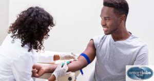 A lab technician drawing a patient's blood sample.