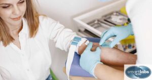 A lab tech prepping a patient for a blood STD test.