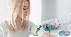 A lab technician applying a tourniquet.