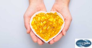 Fish oil (Omega 3) softgell capsules in a heart-shaped bowl.