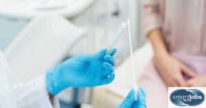 A lab technician prepping a swab stick for taking a patient's gential sore cell sample.