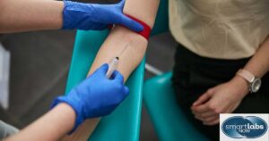 A lab technician drawing a patient's blood for CBC testing.