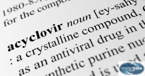 A virology text opened on a page detailing the specifics of Acyclovir