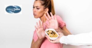 A woman being offered food items she's allergic/sensitive to.