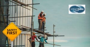 Construction workers standing on a job site.